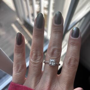 Pandora rose gold with Clear Gemstone.  Cushion cut size 7